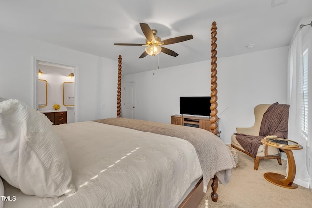 carpeted bedroom featuring ceiling fan and ensuite bathroom