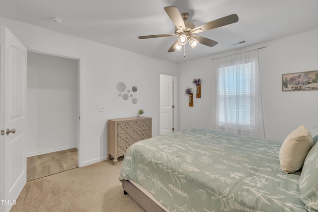 bedroom with visible vents, a ceiling fan, carpet, and baseboards