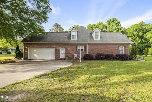 406 N Wakefield St, Zebulon, NC 27597 - view of front of home featuring a garage, concrete driveway, a front yard, and brick siding