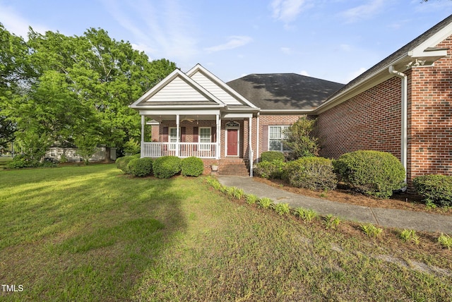 406 N Wakefield St, Zebulon, NC 27597 - view of front of property featuring brick siding, a porch, and a front yard