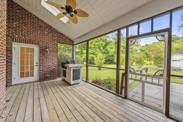 406 N Wakefield St, Zebulon, NC 27597 - unfurnished sunroom with a ceiling fan, vaulted ceiling, and view of scattered trees