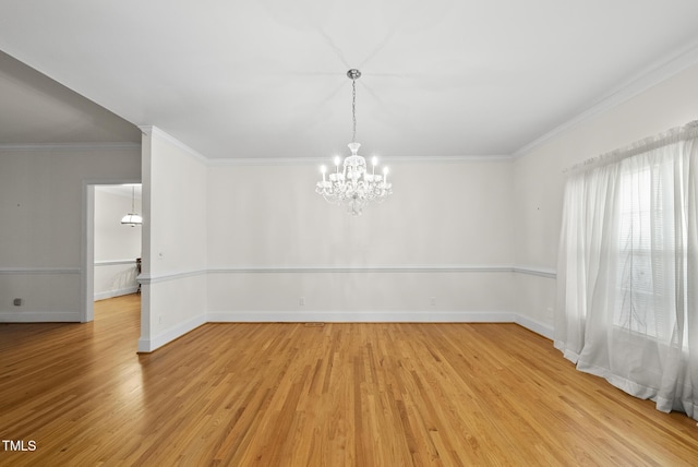 406 N Wakefield St, Zebulon, NC 27597 - unfurnished room featuring a chandelier, light wood finished floors, crown molding, and baseboards