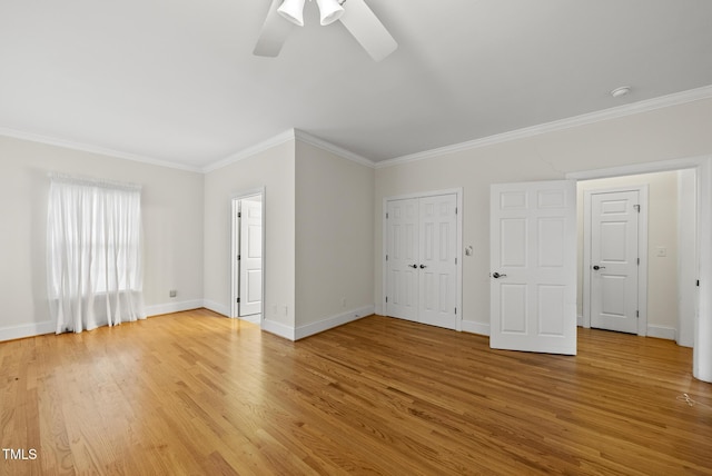 406 N Wakefield St, Zebulon, NC 27597 - unfurnished living room featuring ornamental molding, light wood finished floors, baseboards, and a ceiling fan
