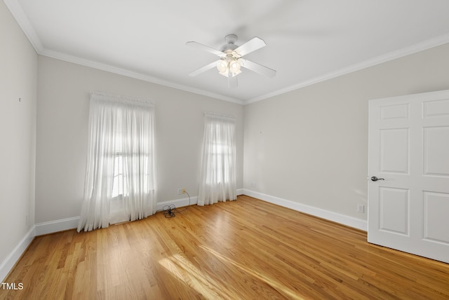 406 N Wakefield St, Zebulon, NC 27597 - spare room with ornamental molding, light wood-style flooring, baseboards, and ceiling fan