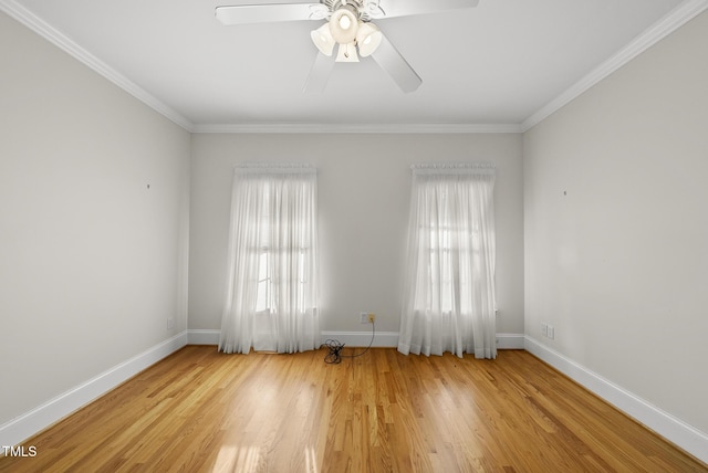 406 N Wakefield St, Zebulon, NC 27597 - spare room featuring crown molding, baseboards, wood finished floors, and ceiling fan