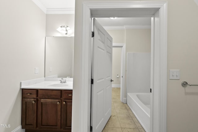 406 N Wakefield St, Zebulon, NC 27597 - bathroom featuring crown molding, vanity, and a bathtub