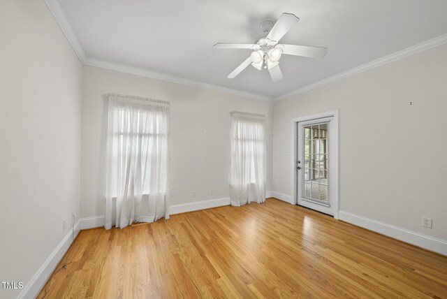 406 N Wakefield St, Zebulon, NC 27597 - empty room with ornamental molding, baseboards, light wood-style flooring, and ceiling fan