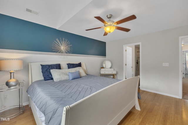 bedroom featuring wood finished floors, baseboards, and ceiling fan