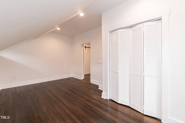 bonus room featuring recessed lighting, vaulted ceiling, dark wood-style floors, and baseboards