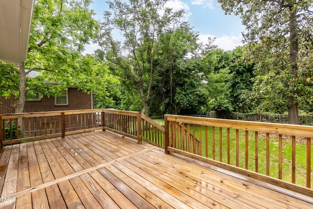wooden deck featuring view of scattered trees