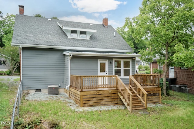 back of house with central AC, a chimney, roof with shingles, and a deck