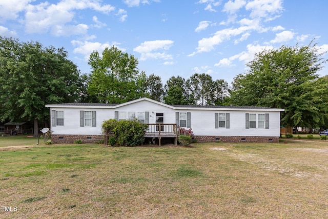 manufactured / mobile home featuring a wooden deck, a front yard, and crawl space