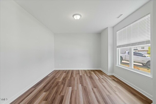 1005 Whispering Creek Ct, Knightdale, NC 27545 - unfurnished room with baseboards and wood finished floors