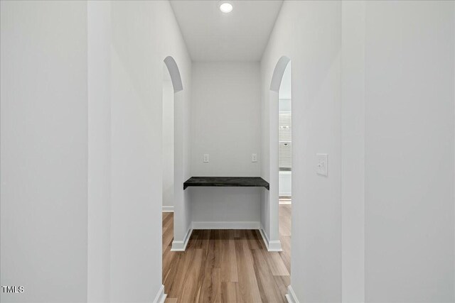 1005 Whispering Creek Ct, Knightdale, NC 27545 - corridor with recessed lighting, arched walkways, light wood-style floors, and baseboards