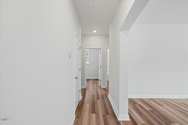 1005 Whispering Creek Ct, Knightdale, NC 27545 - hall featuring baseboards, wood finished floors, and recessed lighting