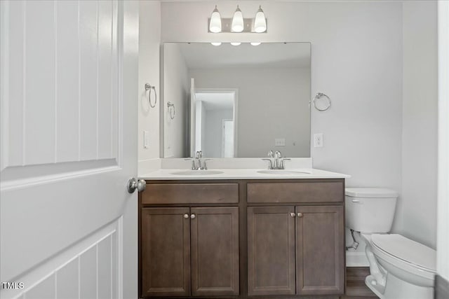 1005 Whispering Creek Ct, Knightdale, NC 27545 - bathroom with a sink, double vanity, and toilet