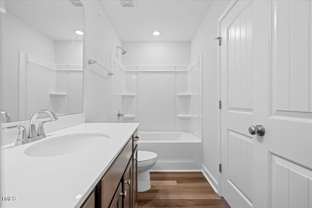1005 Whispering Creek Ct, Knightdale, NC 27545 - full bath with wood finished floors, visible vents, toilet, vanity, and bathtub / shower combination