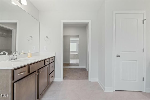 1005 Whispering Creek Ct, Knightdale, NC 27545 - bathroom featuring baseboards, vanity, and tile patterned floors