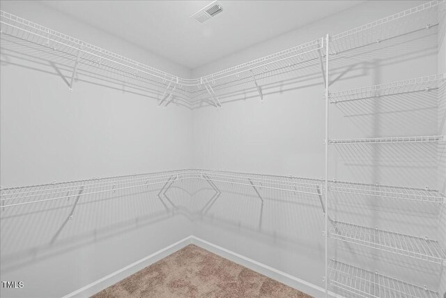 1005 Whispering Creek Ct, Knightdale, NC 27545 - walk in closet featuring carpet flooring and visible vents