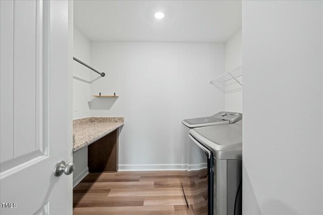 1005 Whispering Creek Ct, Knightdale, NC 27545 - laundry room with recessed lighting, light wood finished floors, laundry area, washing machine and dryer, and baseboards