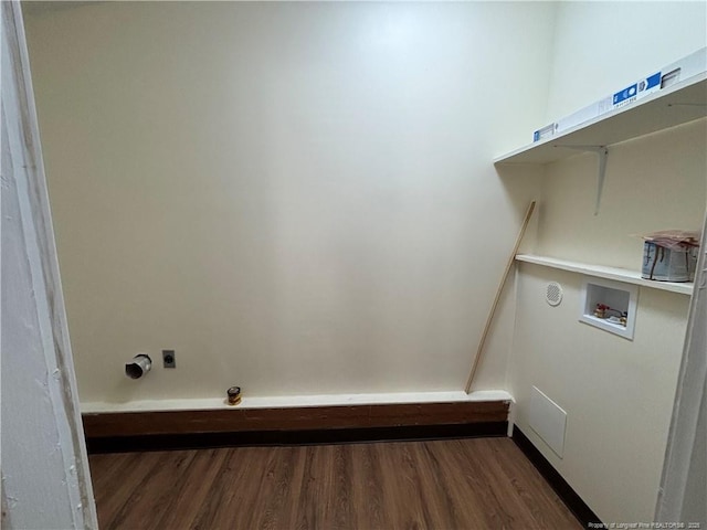 clothes washing area featuring washer hookup, hookup for an electric dryer, wood finished floors, and laundry area