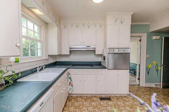 kitchen featuring dishwasher, a sink, under cabinet range hood, white cabinetry, and oven