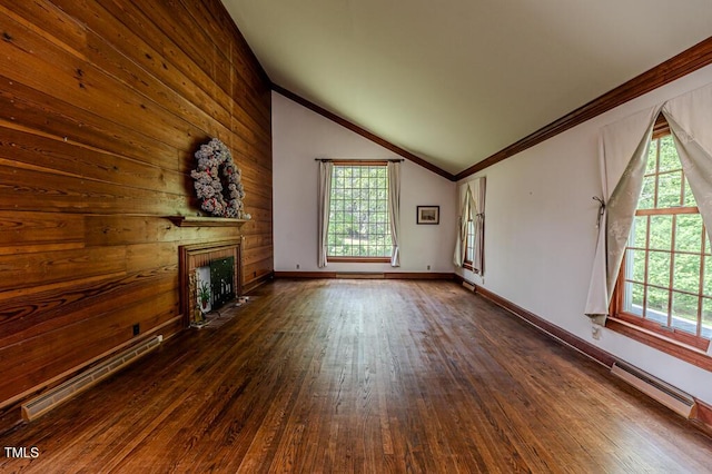 unfurnished living room featuring a fireplace with flush hearth, crown molding, vaulted ceiling, a baseboard heating unit, and dark wood-style floors