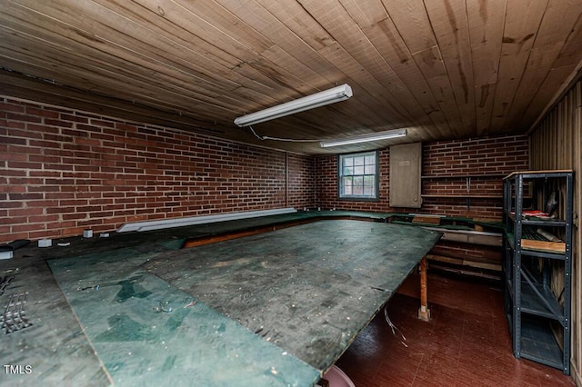 recreation room with brick wall and wood ceiling