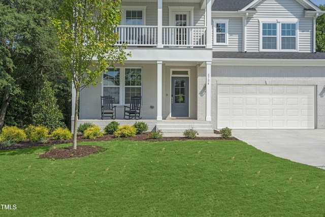 view of front of property featuring a front lawn, an attached garage, a balcony, concrete driveway, and a porch
