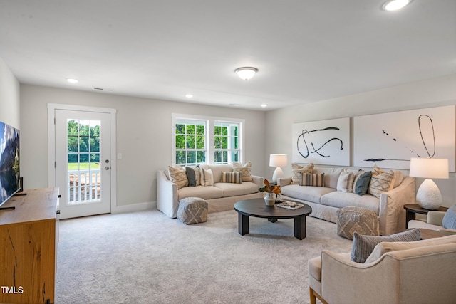 living area with baseboards, carpet flooring, recessed lighting, and visible vents