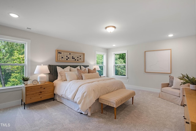 bedroom featuring light colored carpet, baseboards, visible vents, and recessed lighting