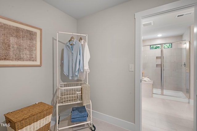 interior space featuring baseboards and visible vents