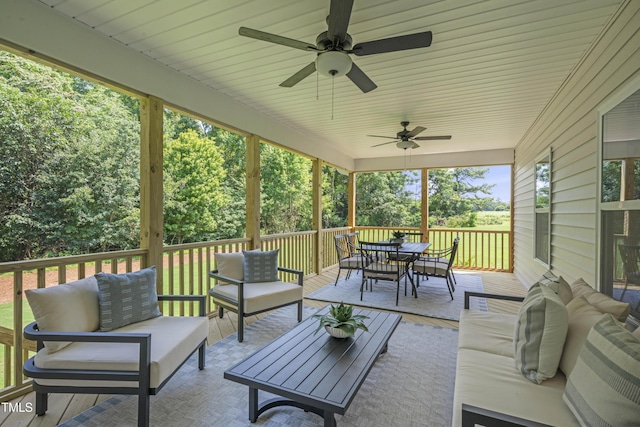 exterior space featuring a ceiling fan, outdoor dining area, and an outdoor living space