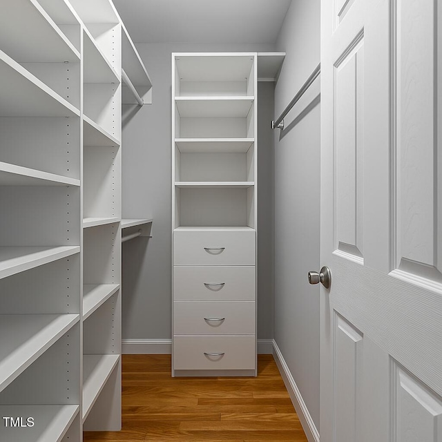 226 Fletcher Ridge Rd, Timberlake, NC 27583 - spacious closet with light wood finished floors