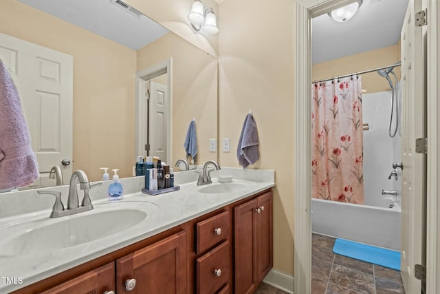 bathroom featuring double vanity and shower / tub combo with curtain