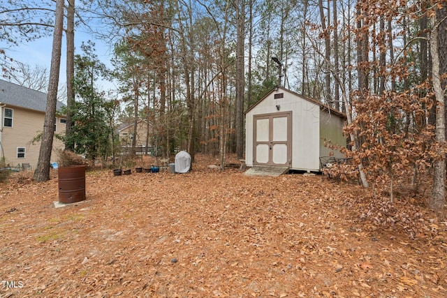 view of yard with a shed and an outbuilding
