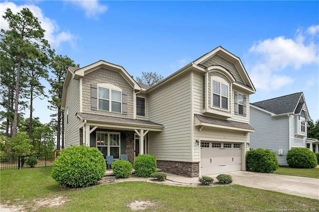 view of front of house featuring a garage, driveway, stone siding, and roof with shingles