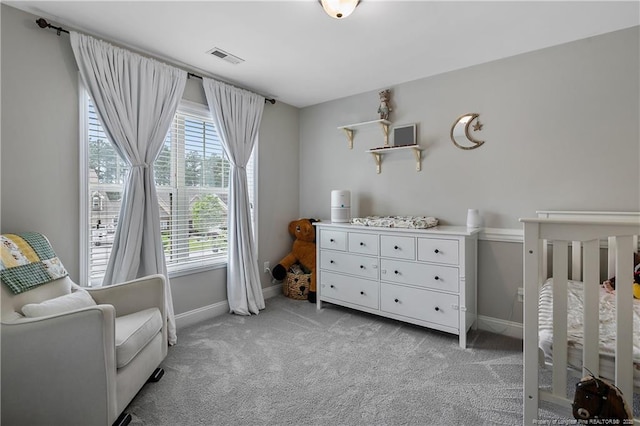 bedroom featuring baseboards and light carpet