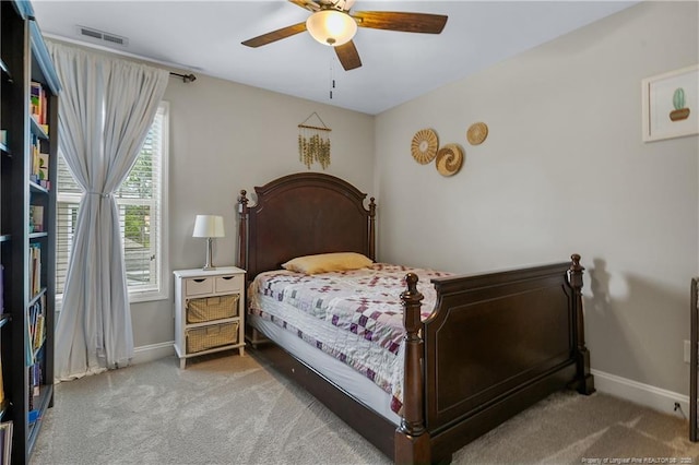 carpeted bedroom with baseboards and ceiling fan