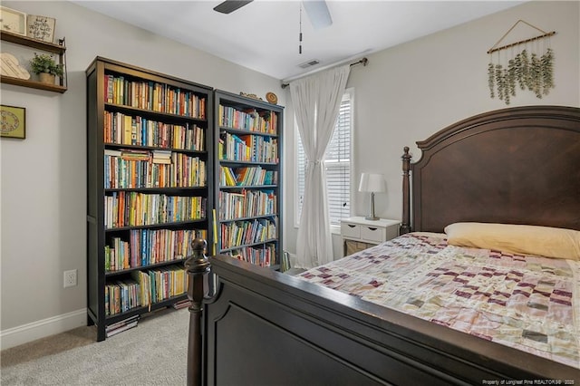 bedroom featuring light colored carpet and baseboards