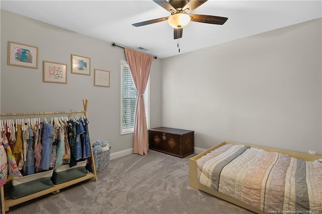 carpeted bedroom featuring baseboards and a ceiling fan