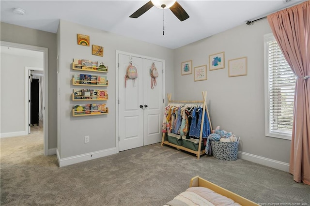 game room with ceiling fan, carpet flooring, plenty of natural light, and baseboards