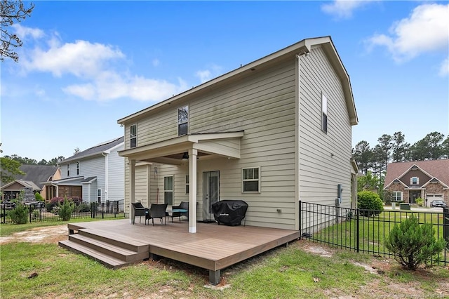 back of house featuring a wooden deck