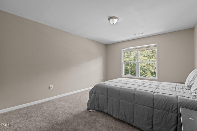 carpeted bedroom with baseboards and visible vents