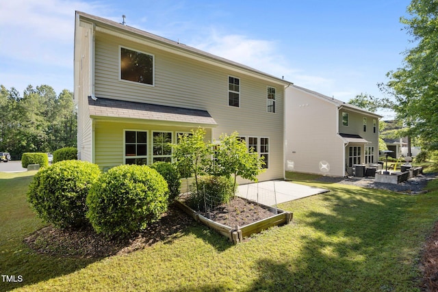 rear view of house with a lawn, central AC unit, an outdoor living space, and a patio area