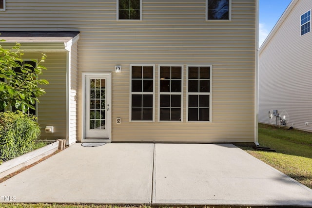 doorway to property featuring a patio