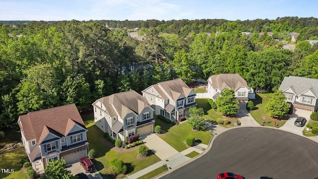 aerial view featuring a residential view and a forest view