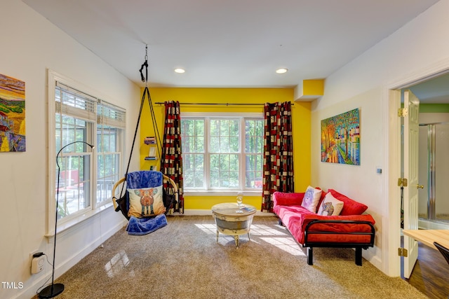sitting room with baseboards, recessed lighting, and carpet floors
