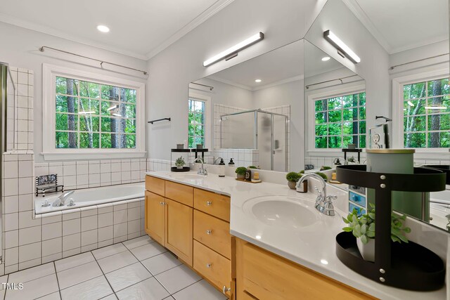 6 Chelan Ct, Durham, NC 27713 - bathroom featuring tile patterned floors, a shower stall, a bath, double vanity, and ornamental molding