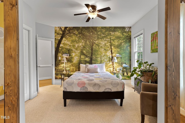 6 Chelan Ct, Durham, NC 27713 - bedroom featuring an accent wall, light carpet, wallpapered walls, ceiling fan, and baseboards